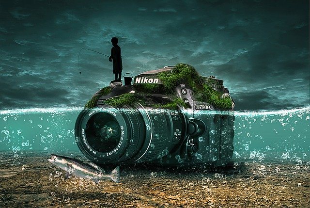 An image of a boy fishing with the camera being under the water.